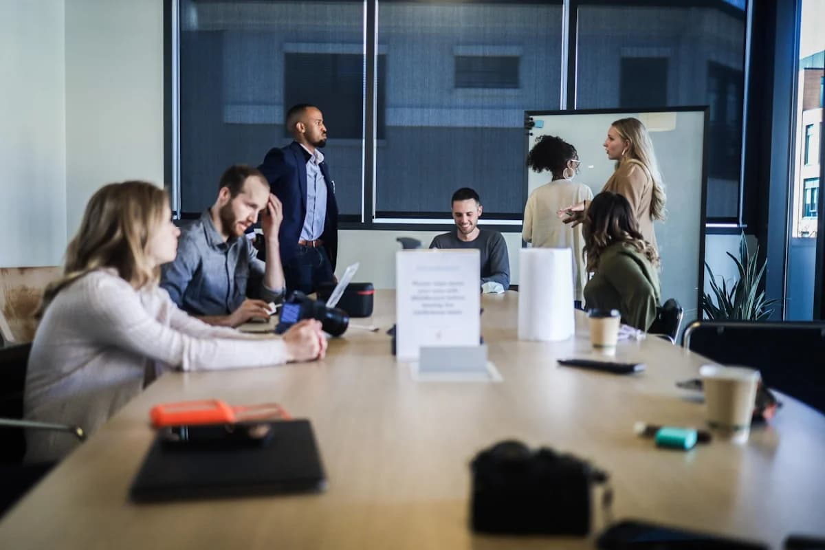 AMED Events planning team collaborating around a conference table.